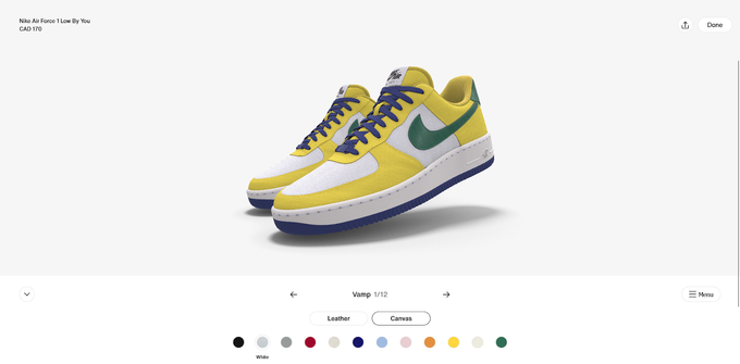A pair of yellow and green sneakers with blue laces customized on Nike's store