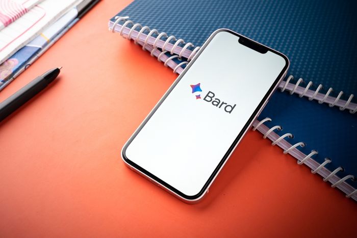 Google Bard open on a smart phone at someone's workspace